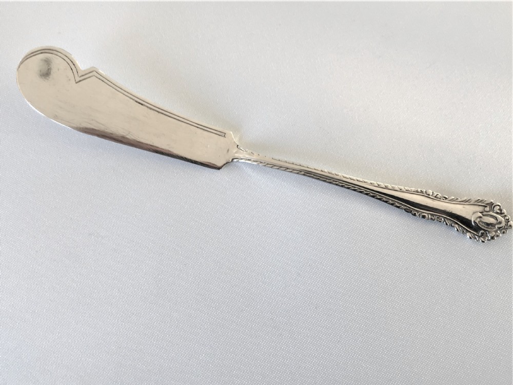 A gorgeous silver butter dish and knife View VII