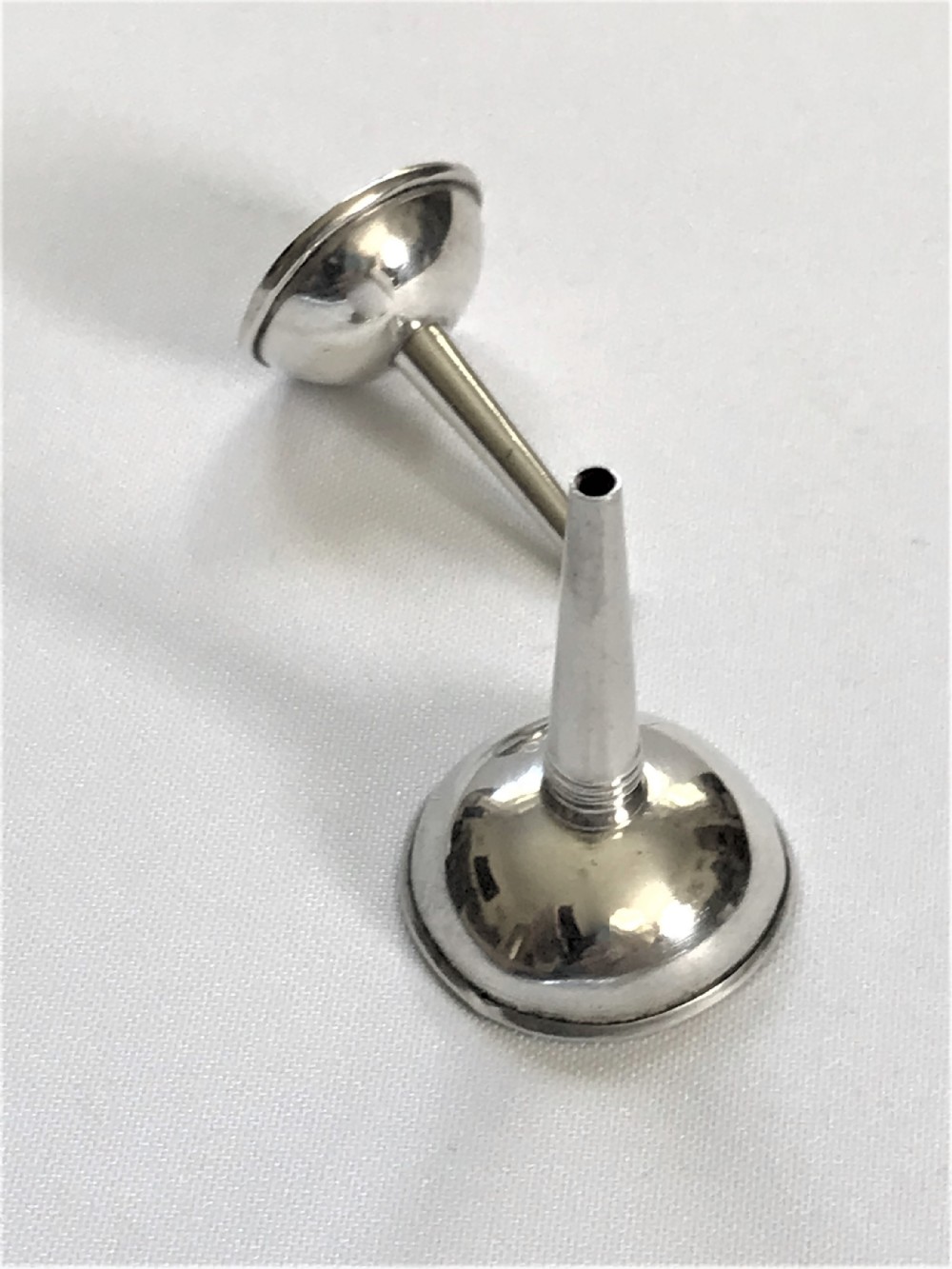 Two Georgian silver perfume funnels
