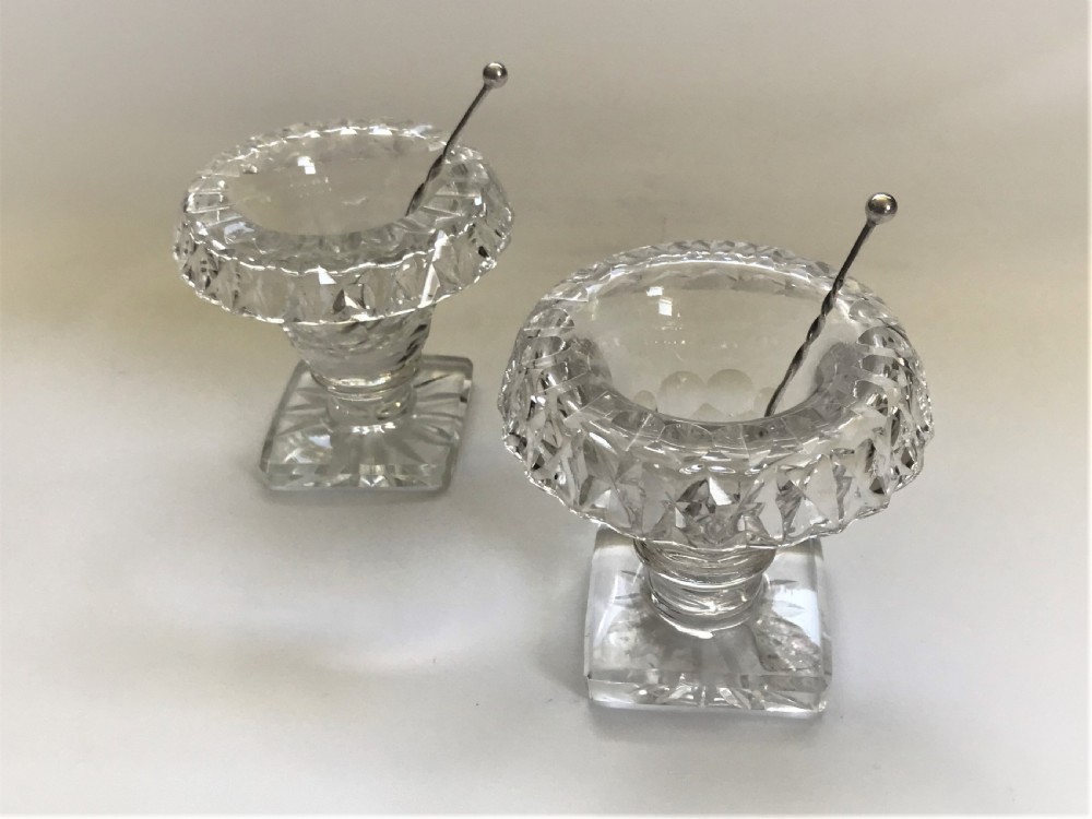 A pair of cut glass Victorian condiment bowls with silver spoons View II