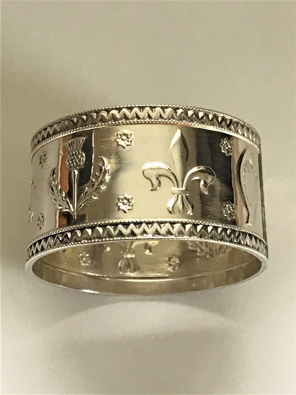 A United Kingdom motif silver napkin ring