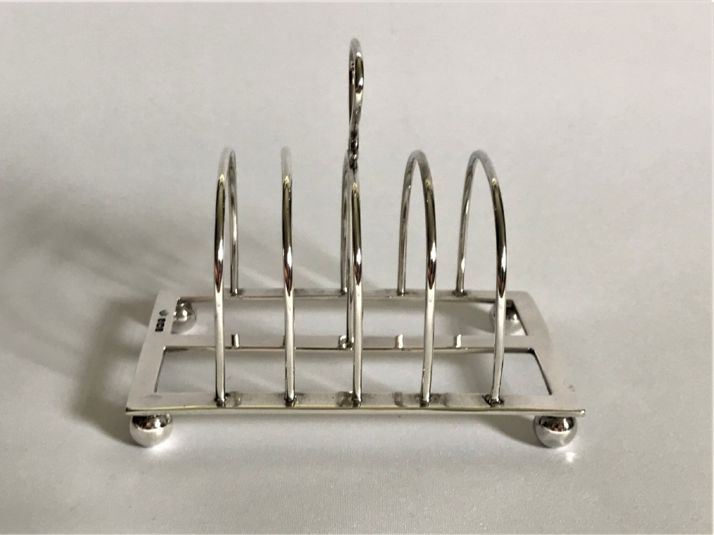 A charming four slice silver toast rack View II