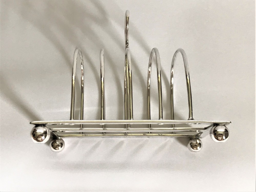 A charming four slice silver toast rack View III