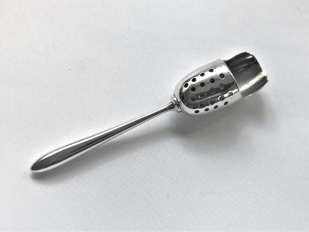 A rare Sterling silver spice sifting scoop