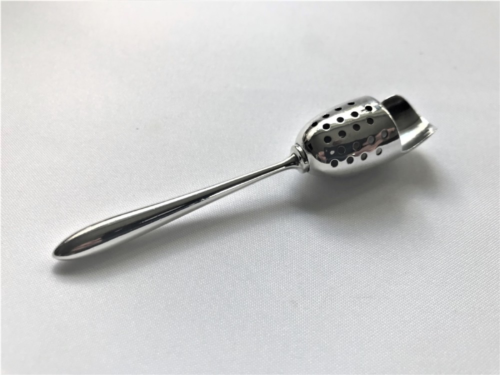 A rare Sterling silver spice sifting scoop View III