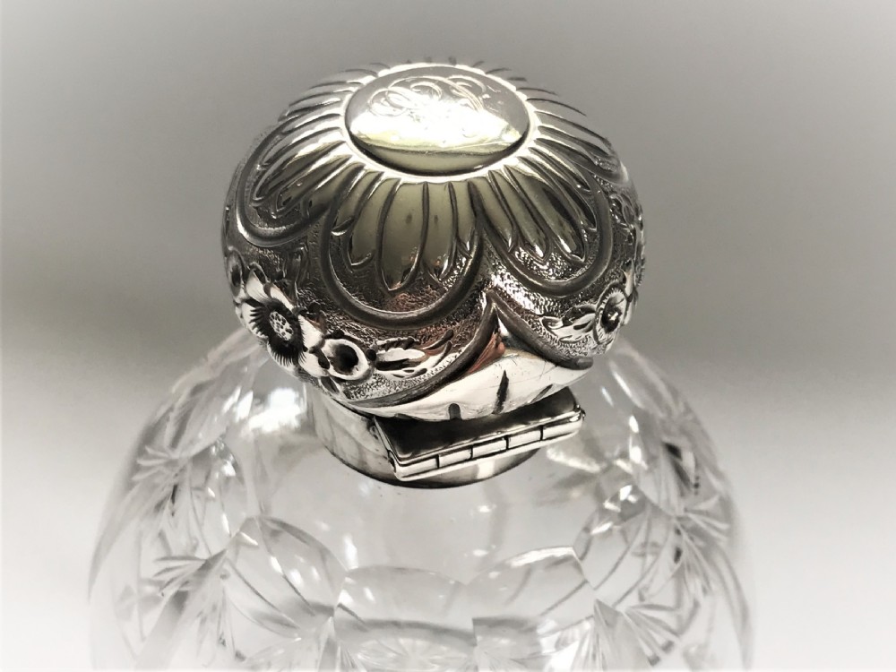 An Edwardian silver mounted cologne bottle View III