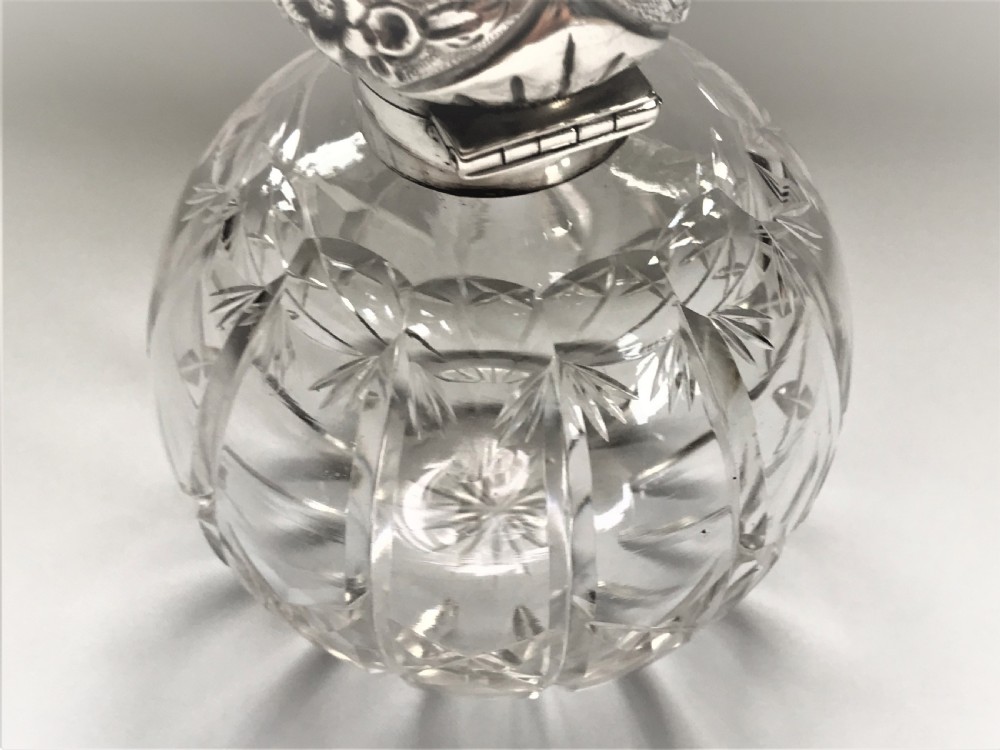 An Edwardian silver mounted cologne bottle View IV