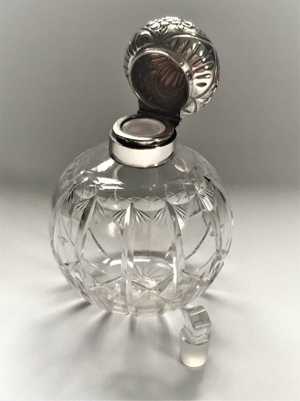 An Edwardian silver mounted cologne bottle View VI