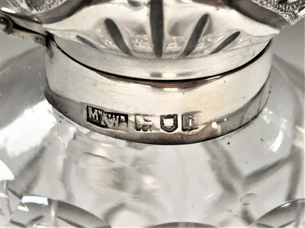 An Edwardian silver mounted cologne bottle View VII