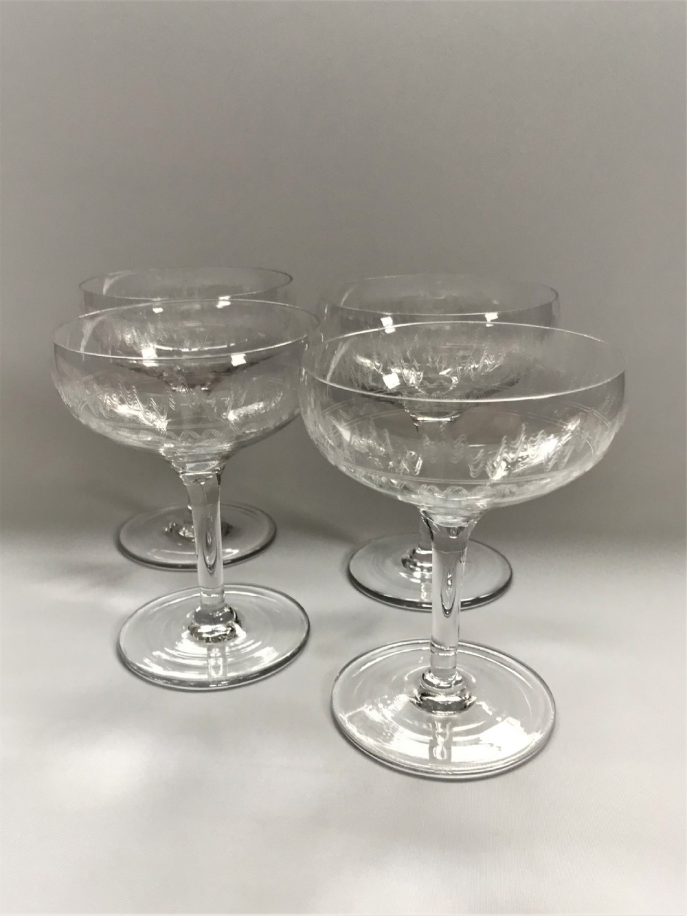A set of 4 etched champagne bowls View II