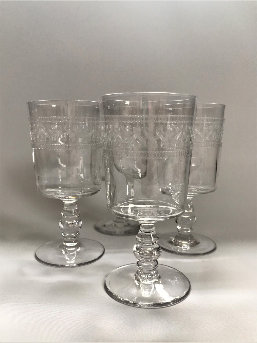 A good set of 4 etched wine goblets View III