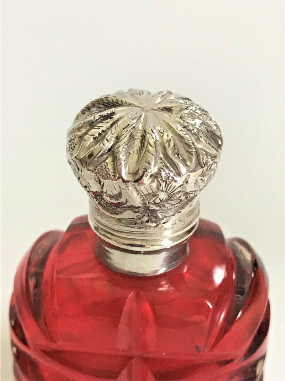 A delightful Victorian cranberry silver mounted scent bottle View V