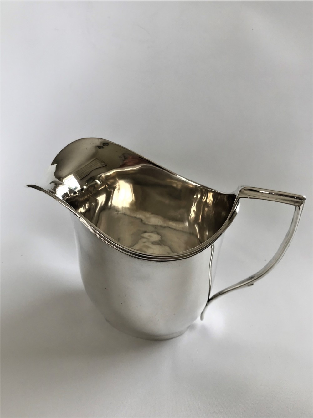 A stylish Georgian silver cream jug View II
