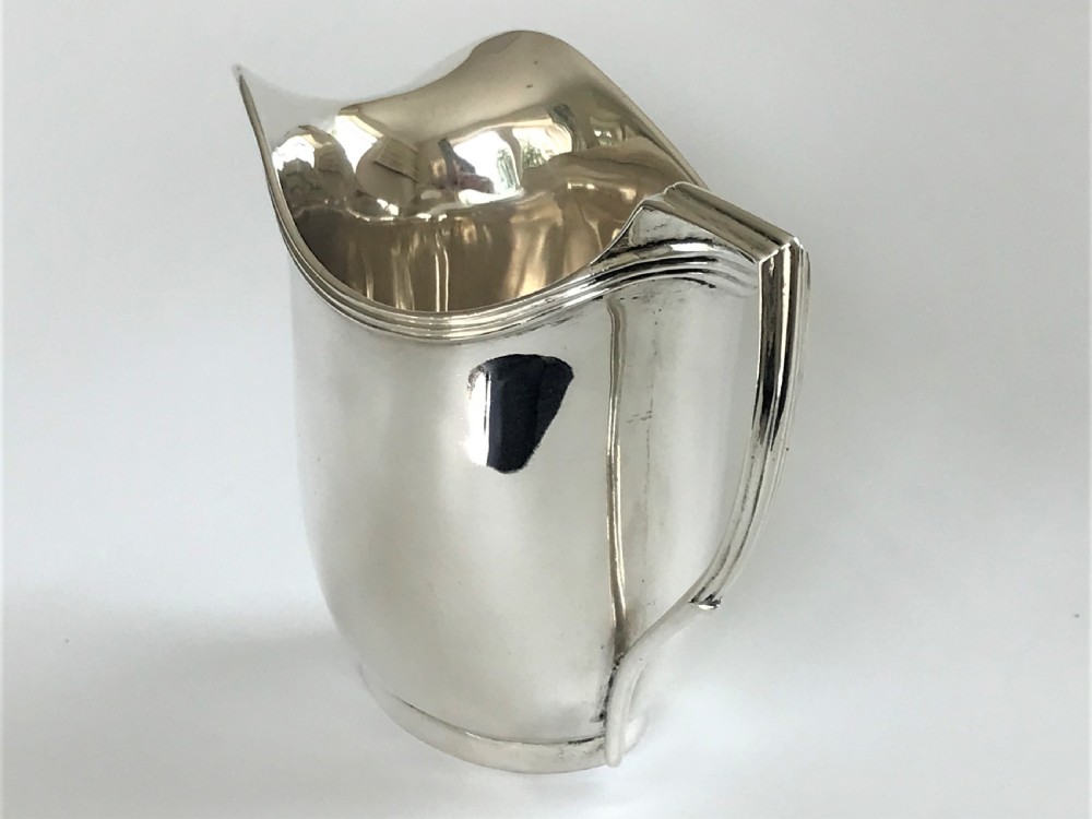 A stylish Georgian silver cream jug View VI