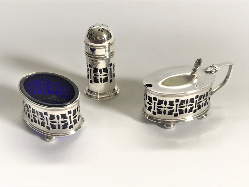 A lovely three piece silver cruet