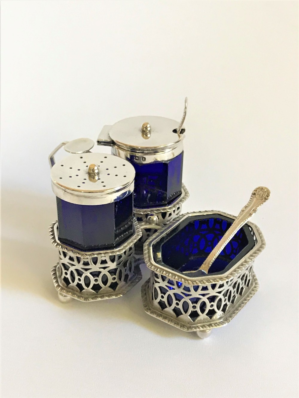 A superb Victorian silver & glass three piece cruet with spoons