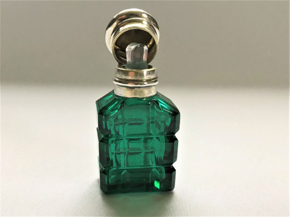 A diminutive Victorian silver mounted scent bottle View II
