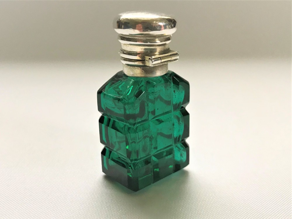 A diminutive Victorian silver mounted scent bottle View VI