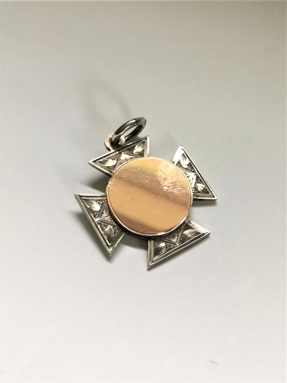 An unusual Silver & gold Muswell Hill fob