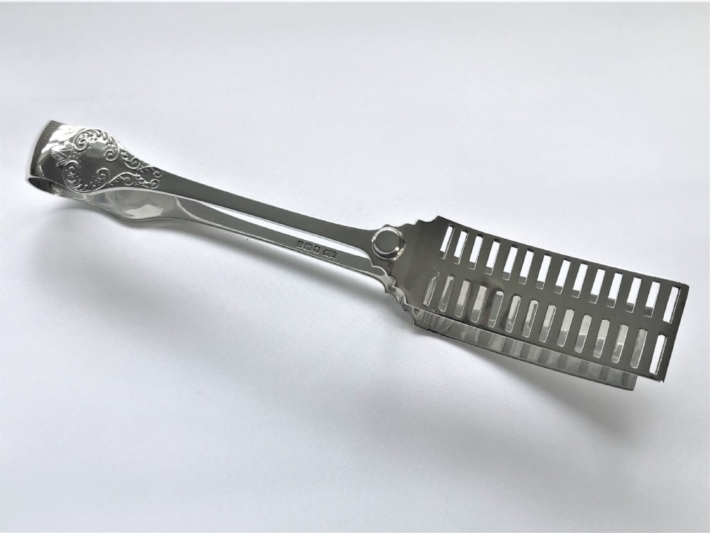 A superb quality pair of silver asparagus tongs