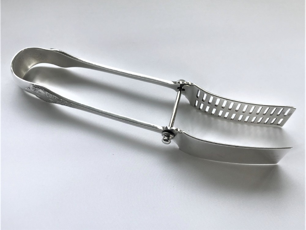 A superb quality pair of silver asparagus tongs View III