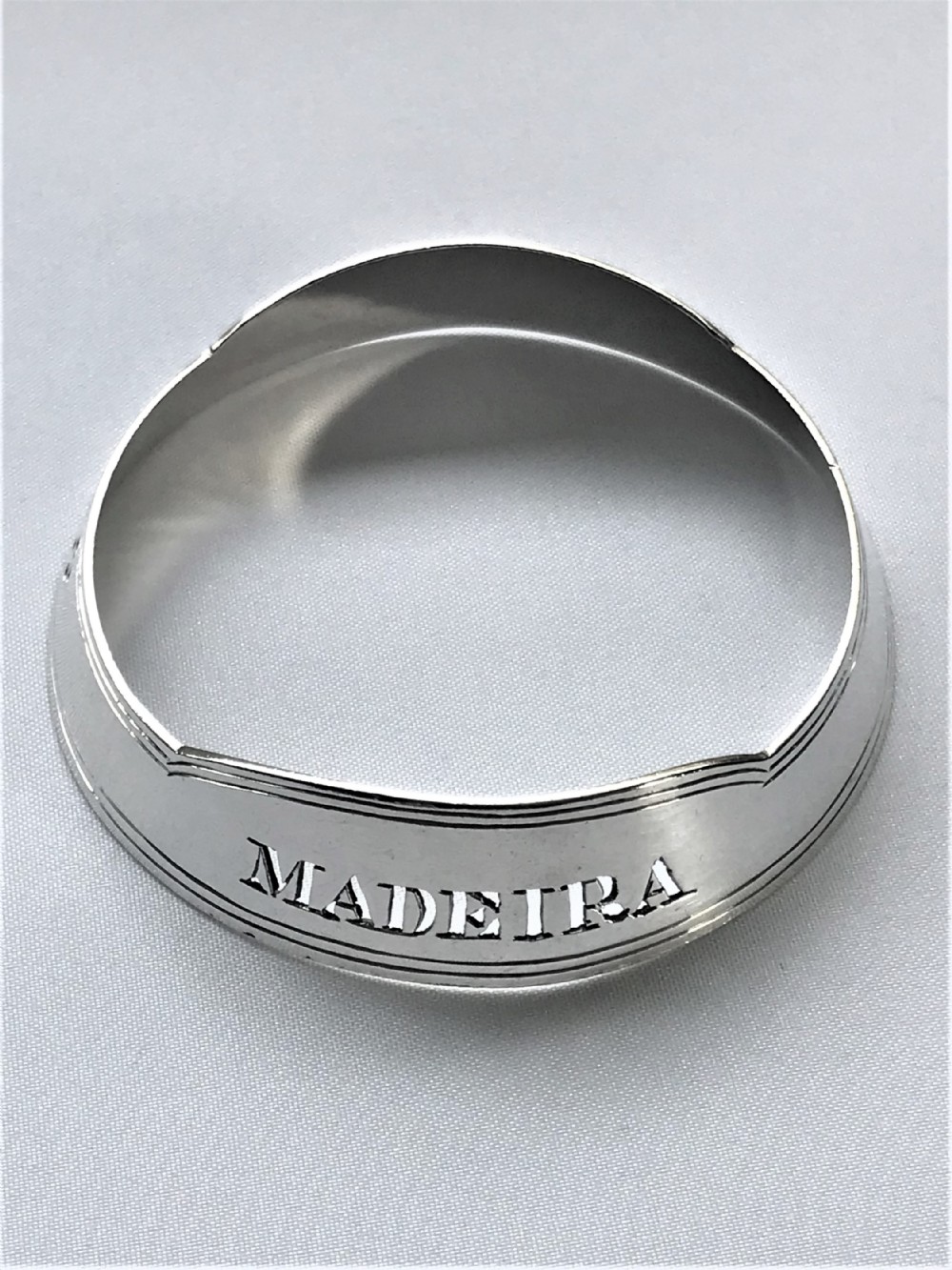 A rare Victorian silver decanter label collar