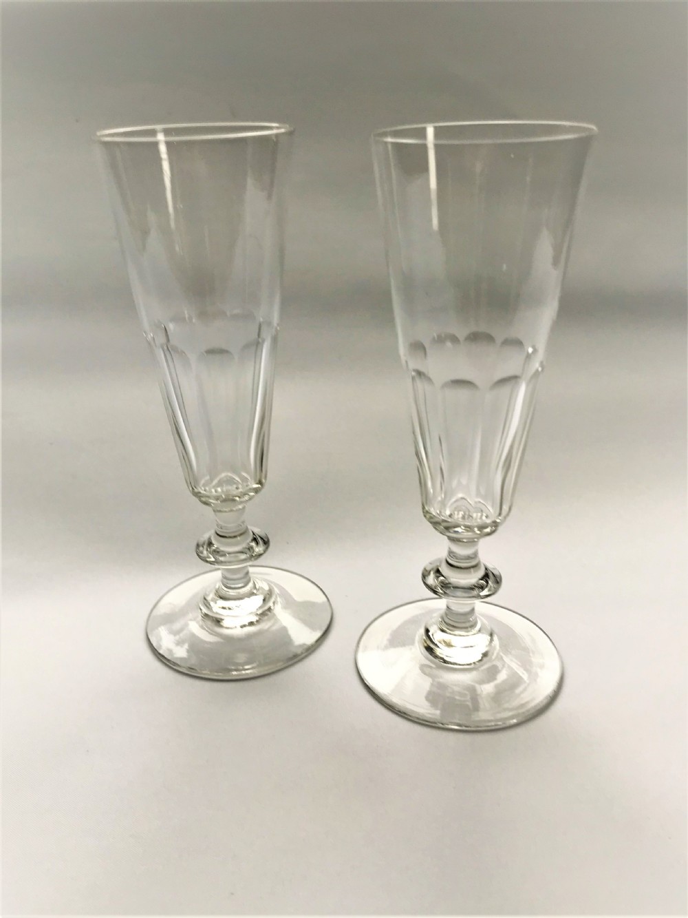 An elegant pair of cut glass champagne flutes