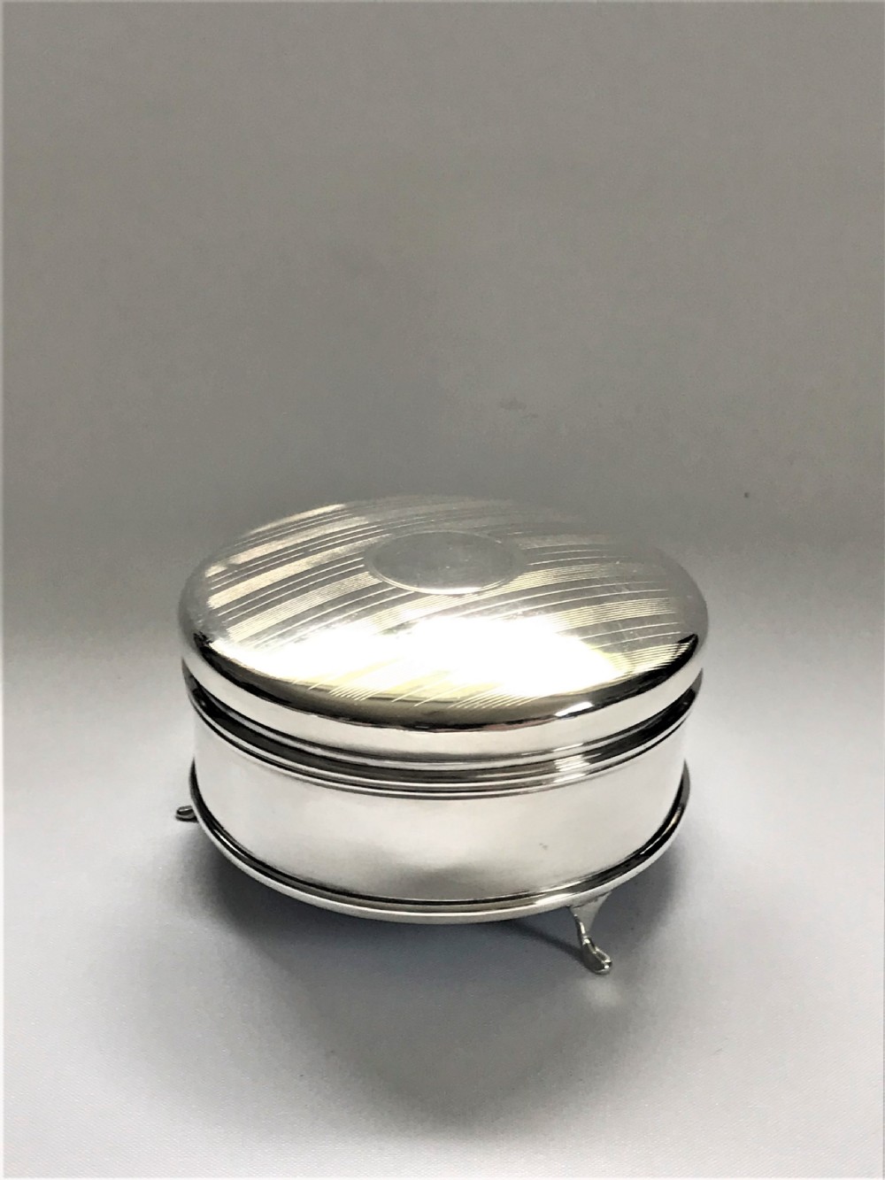 A stylish silver trinket/cuff links box