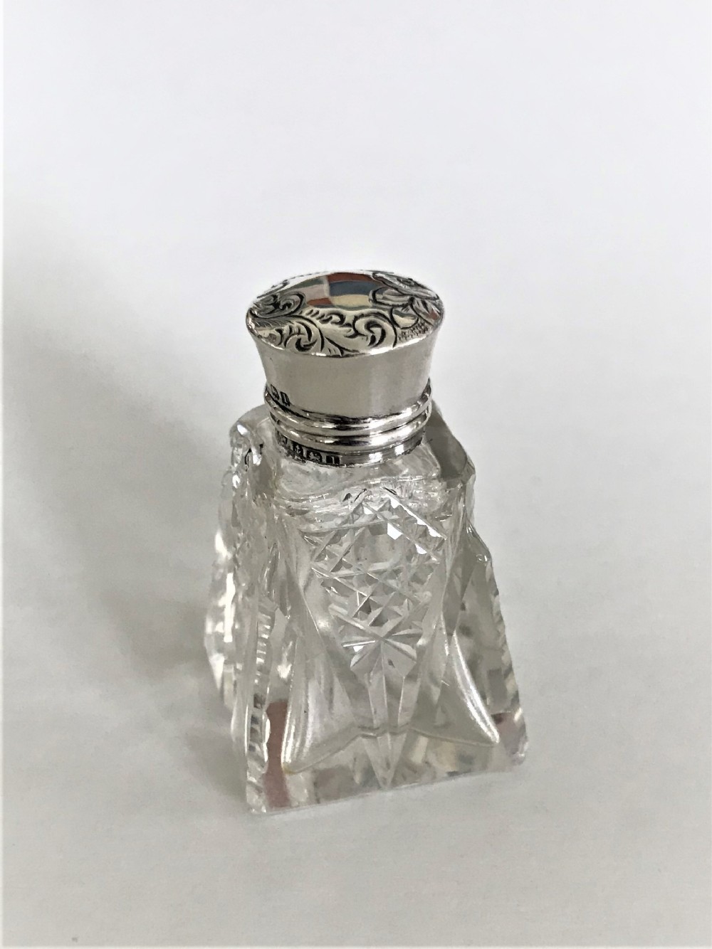 A charming Edwardian silver mounted scent bottle