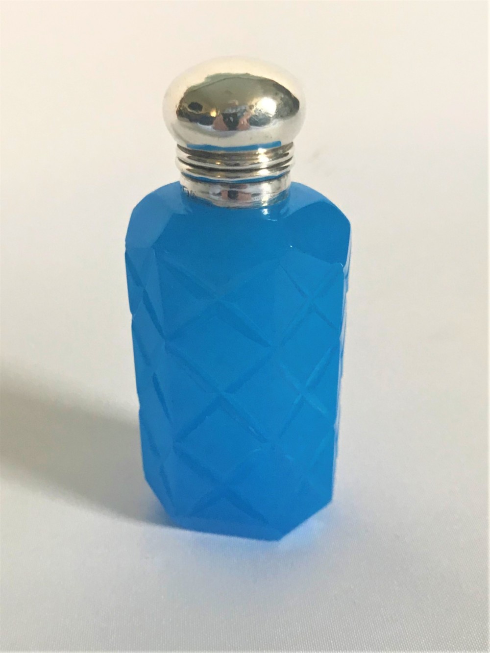 An unusual Edwardian silver mounted opaline scent bottle