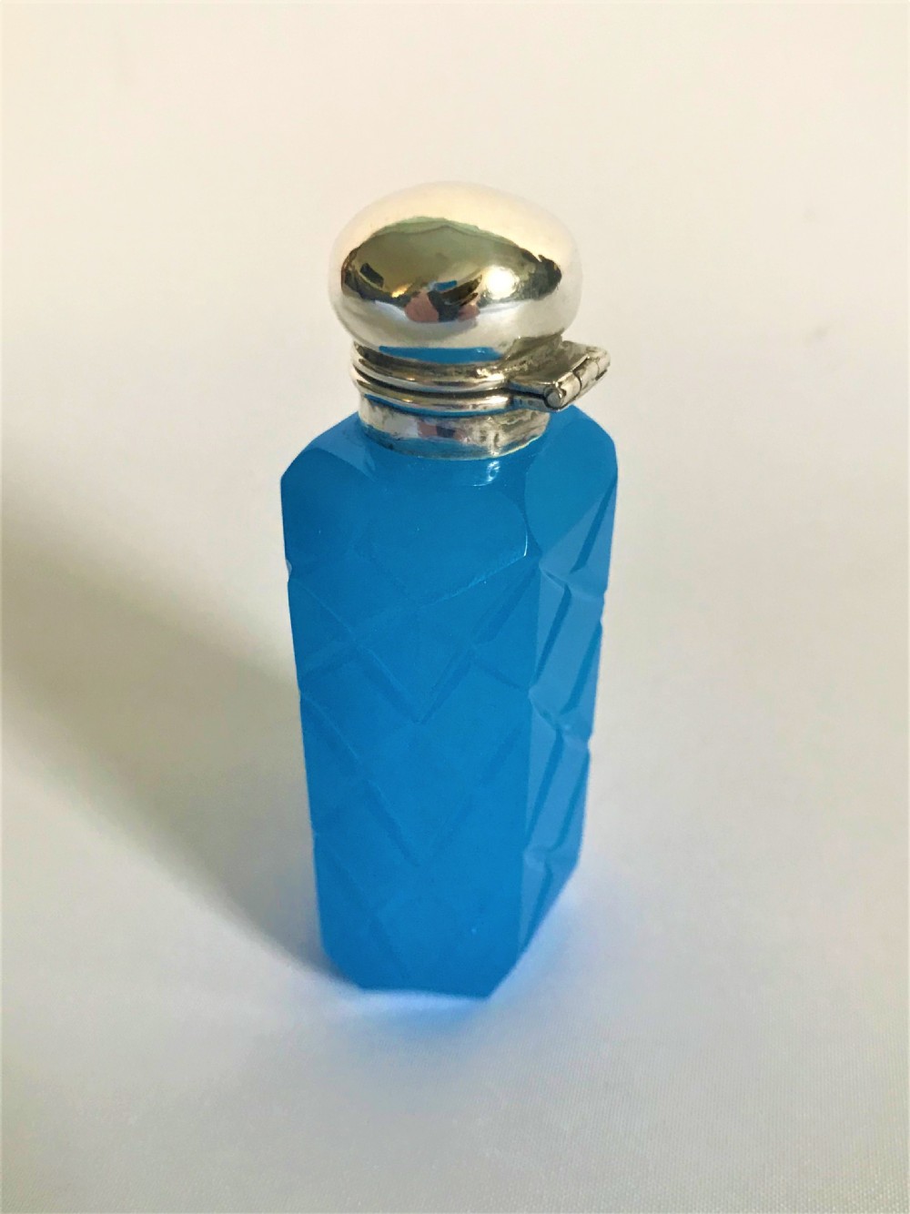 An unusual Edwardian silver mounted opaline scent bottle View II