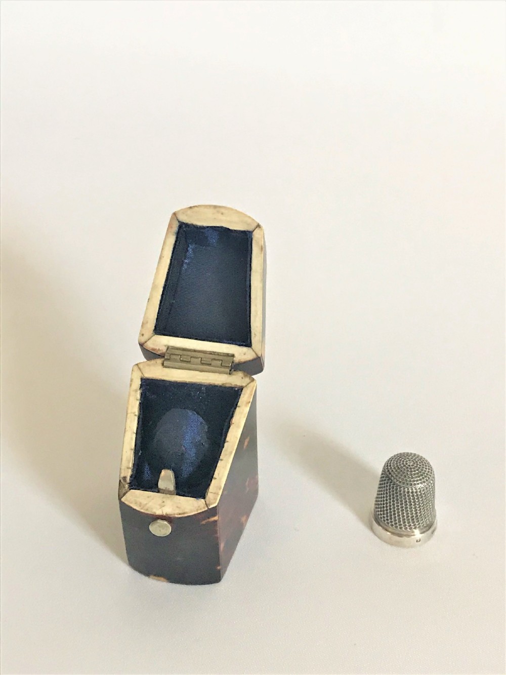 A 19th Century tortoiseshell cased silver thimble View IV