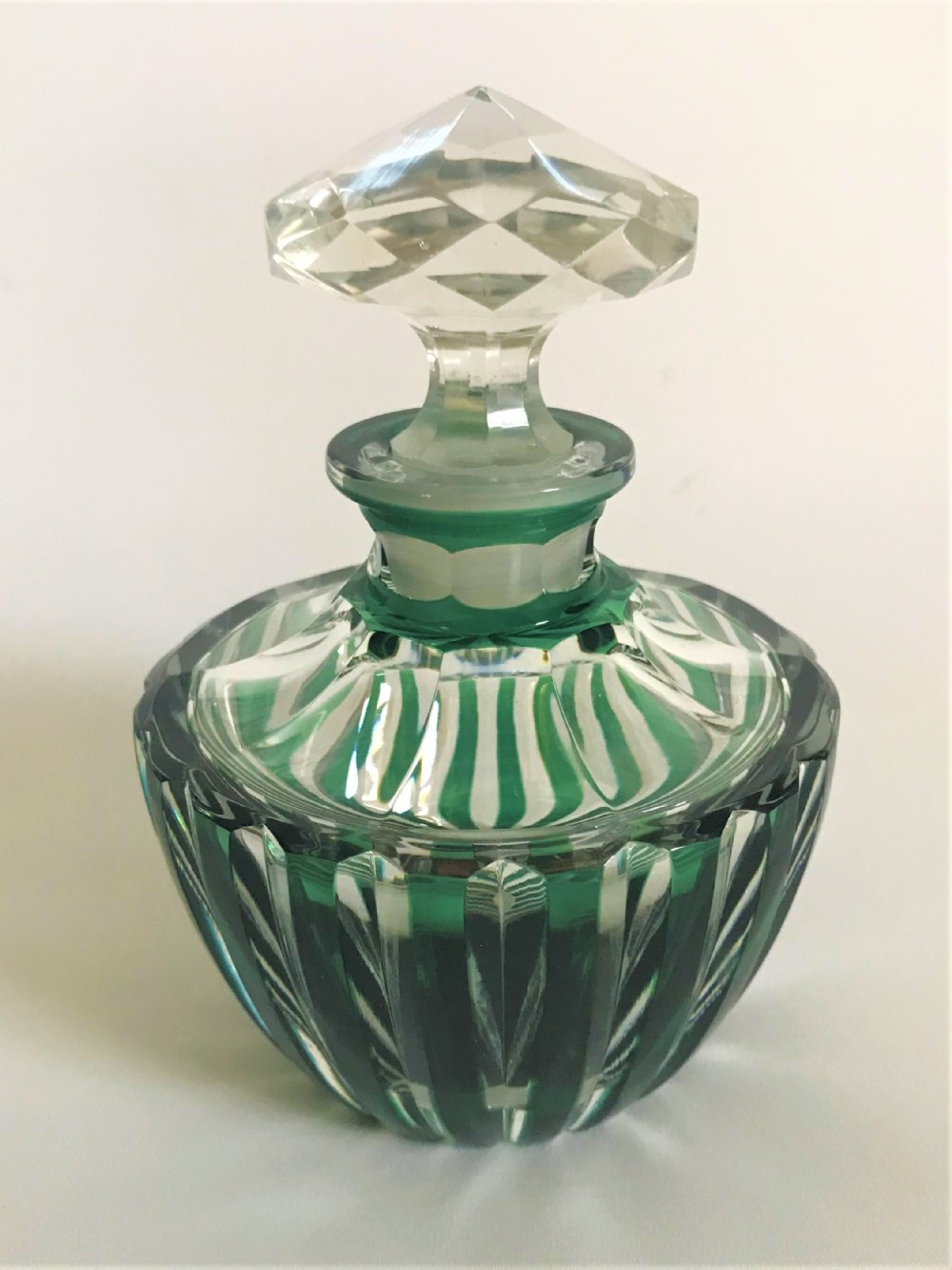 An eye catching Art Deco cut glass cologne bottle