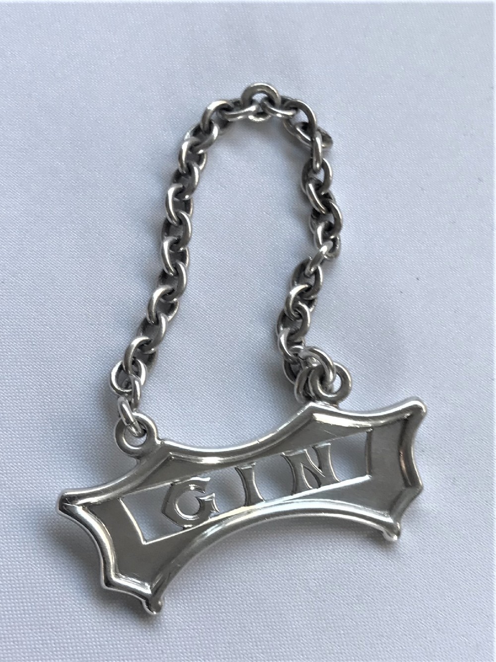 A superior Edwardian silver Gin decanter label