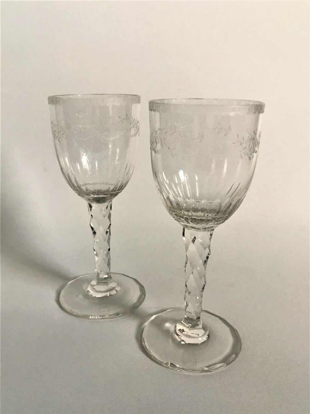 A superb pair of cut and etched cordial glasses