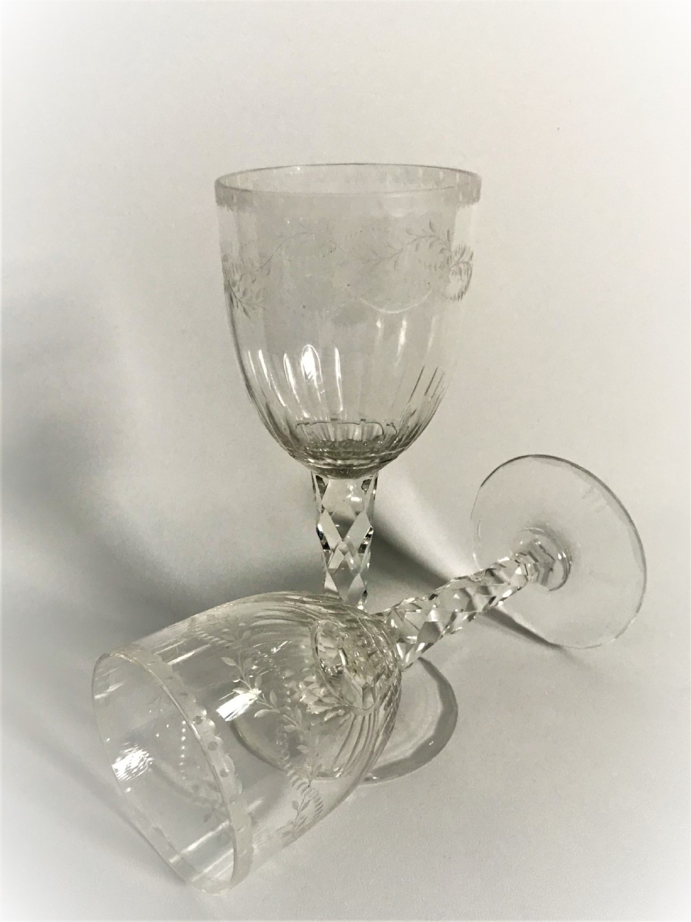 A superb pair of cut and etched cordial glasses View V