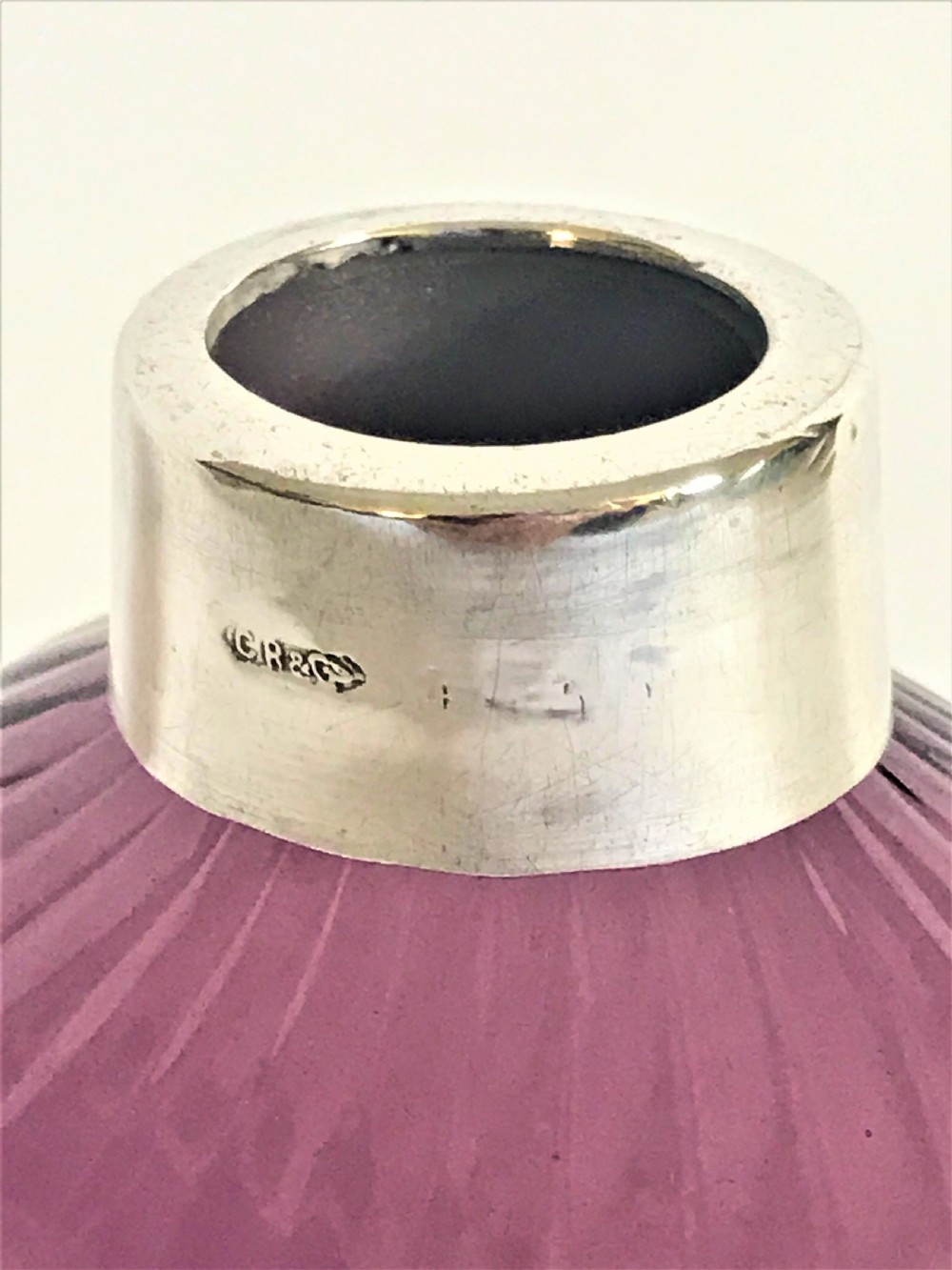A silver mounted amethyst glass cologne bottle View IV