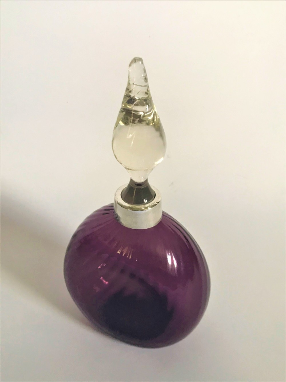 A silver mounted amethyst glass cologne bottle View V