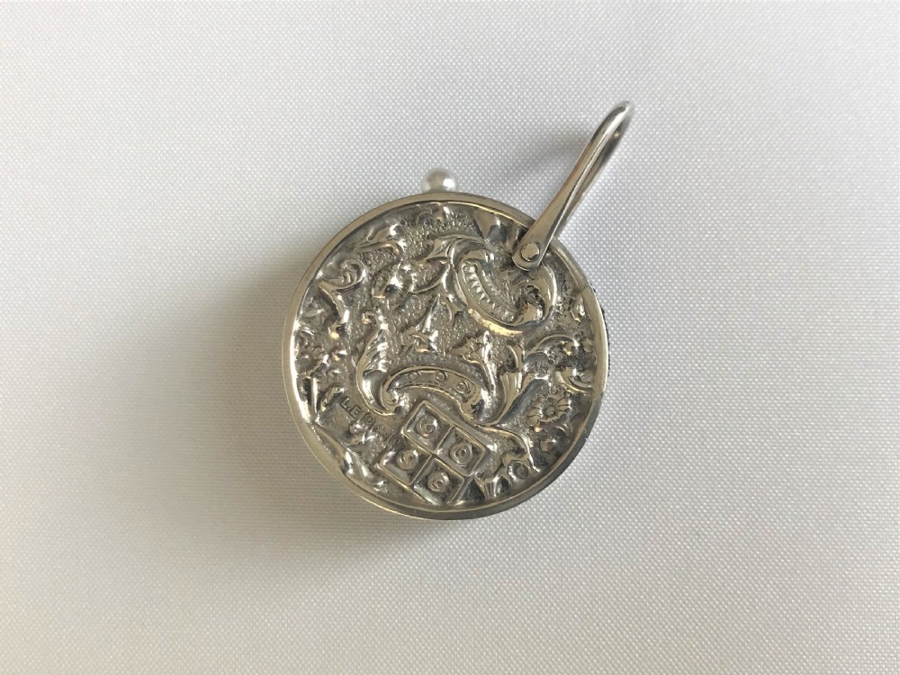 A charming Edwardian silver 'wheel' pin cushion 