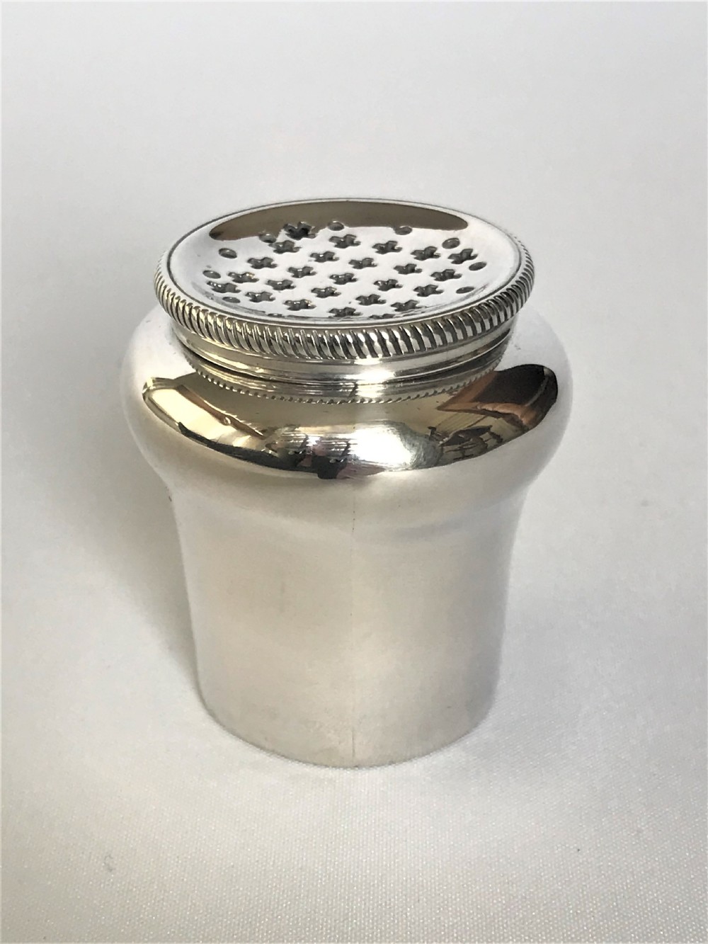 A Magdalen Feline hallmarked 18th Century silver pounce pot