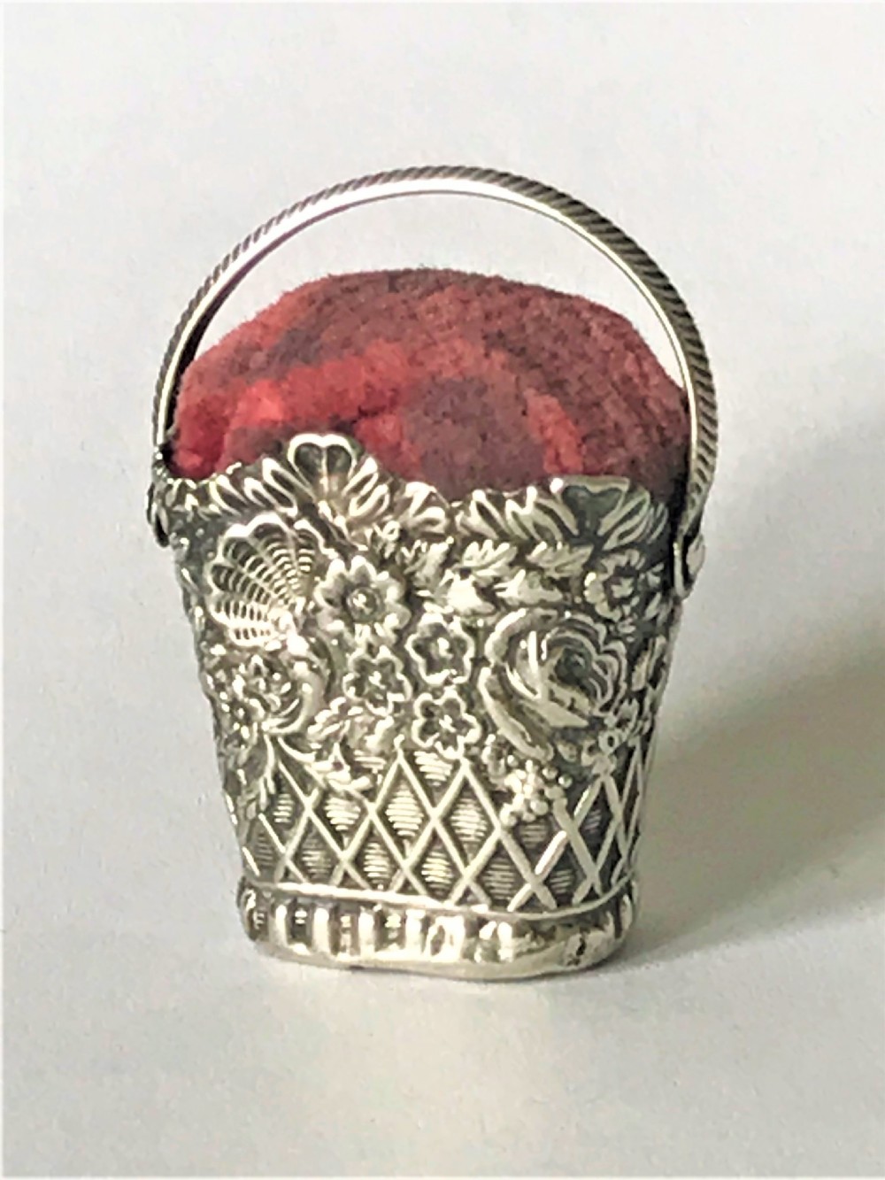 A lovely Georgian silver basket pin cushion