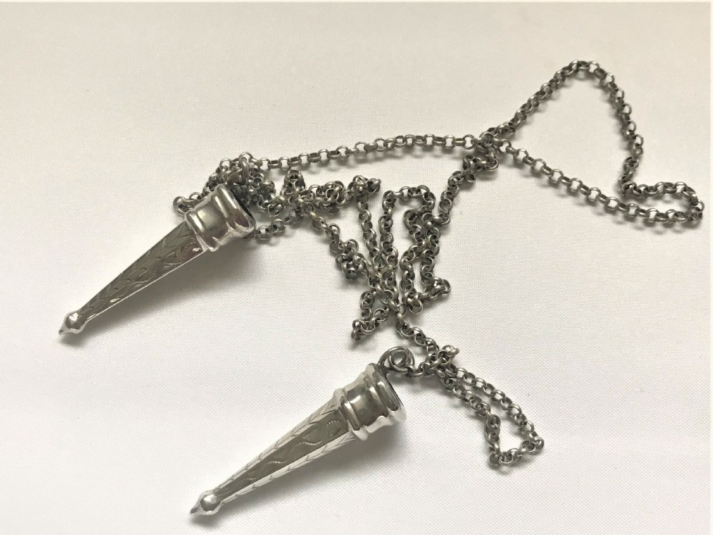 A rare pair of Dutch silver needle guards
