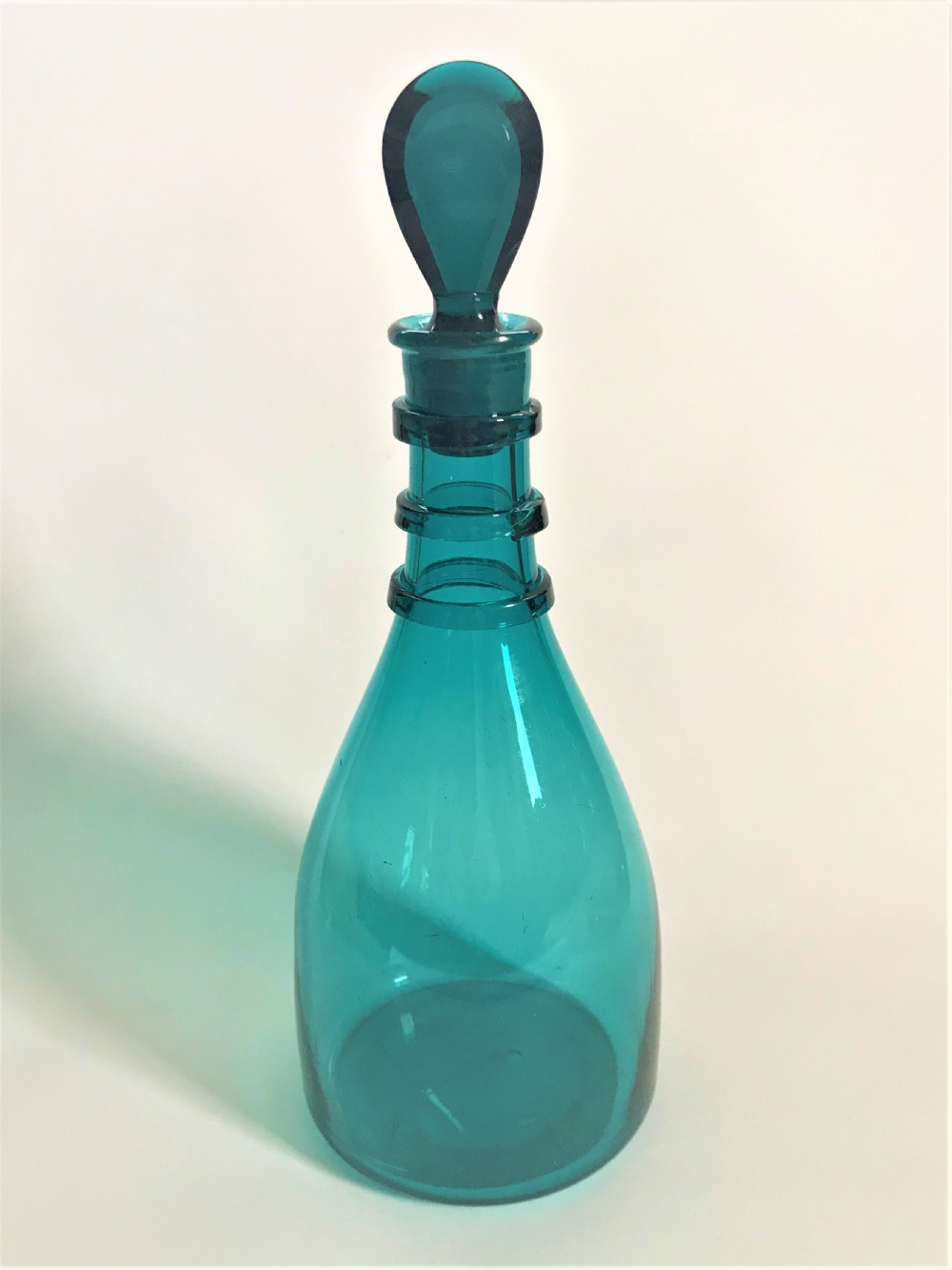 A rare Georgian decanter in unusual teal colour