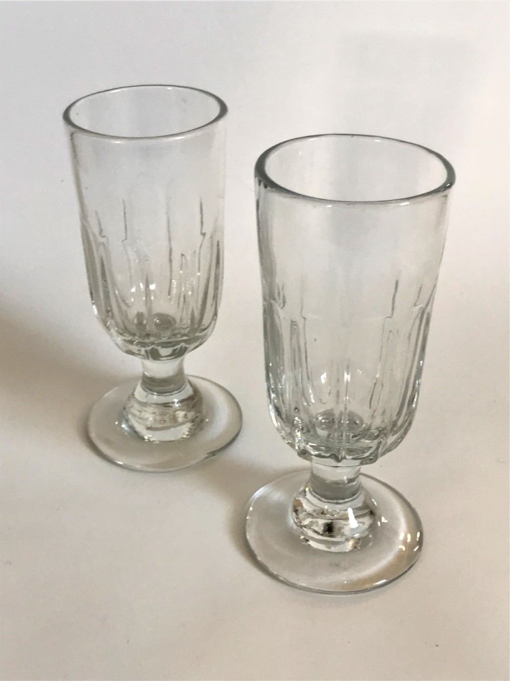 A pair of Georgian petal molded dwarf ale glasses