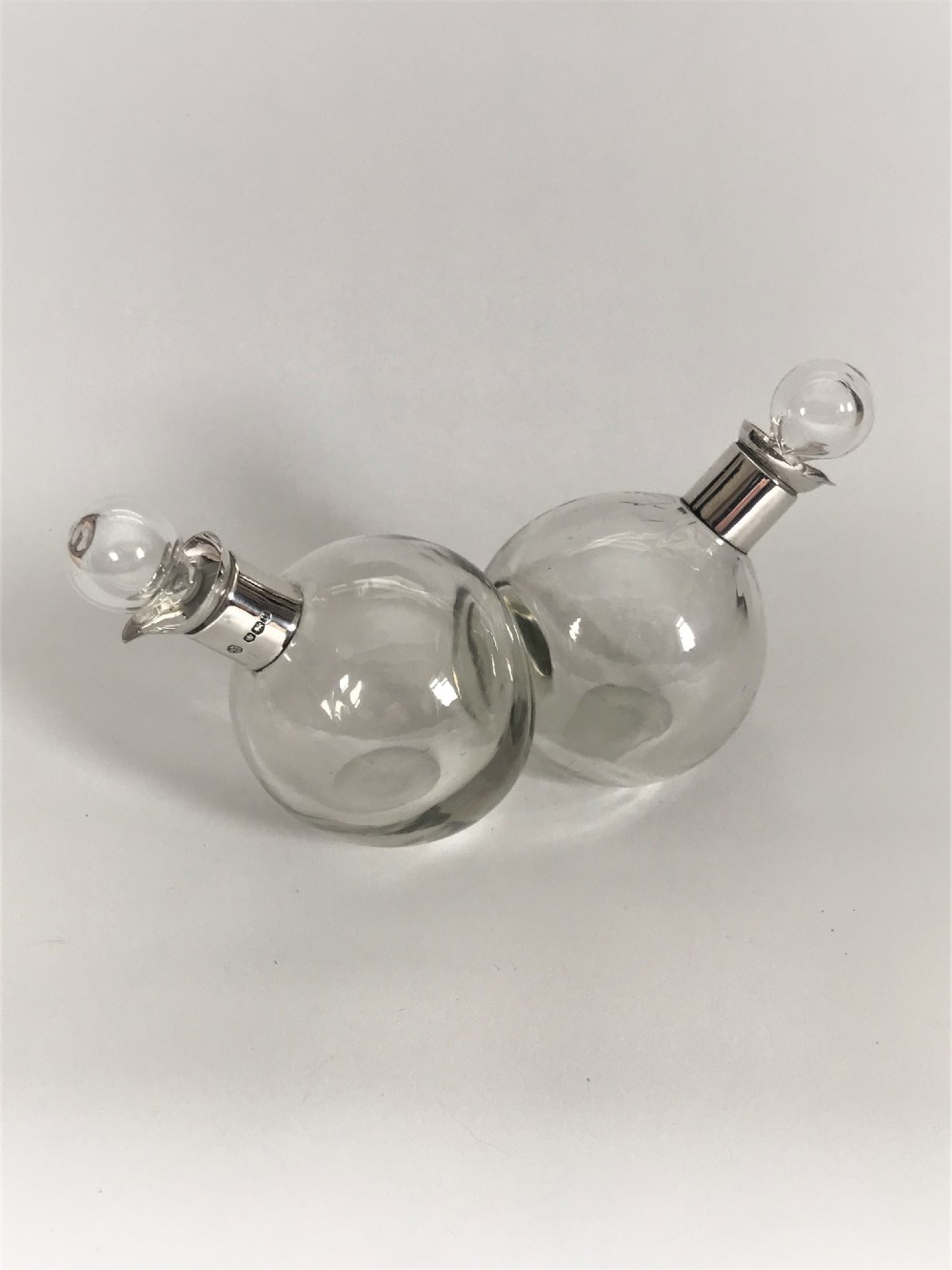 A charming silver mounted oil & vinegar set