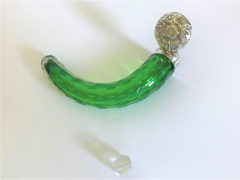 An Edwardian silver mounted 'cornucopia' emerald green scent bottle View V