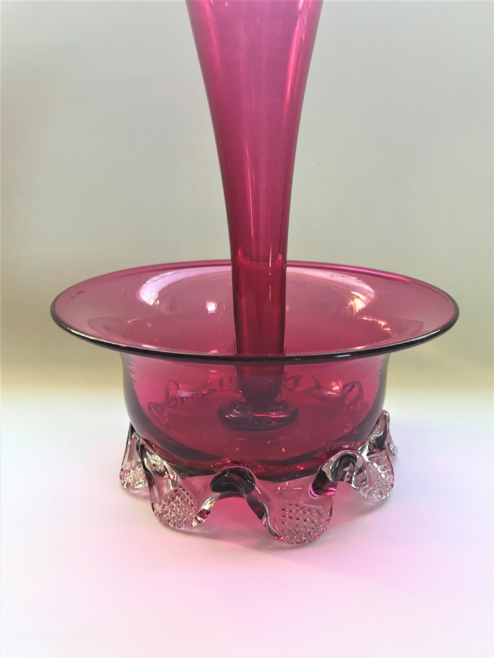 A Victorian cranberry trumpet vase with flower bowl View V