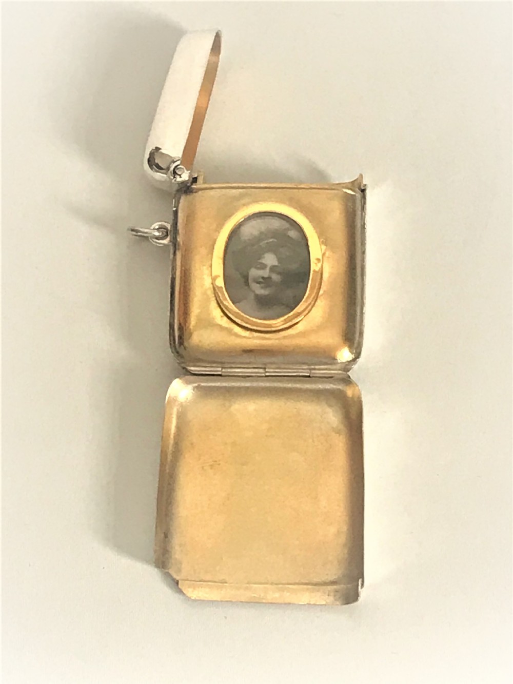 A superb novelty Edwardian silver vesta with photo frame
