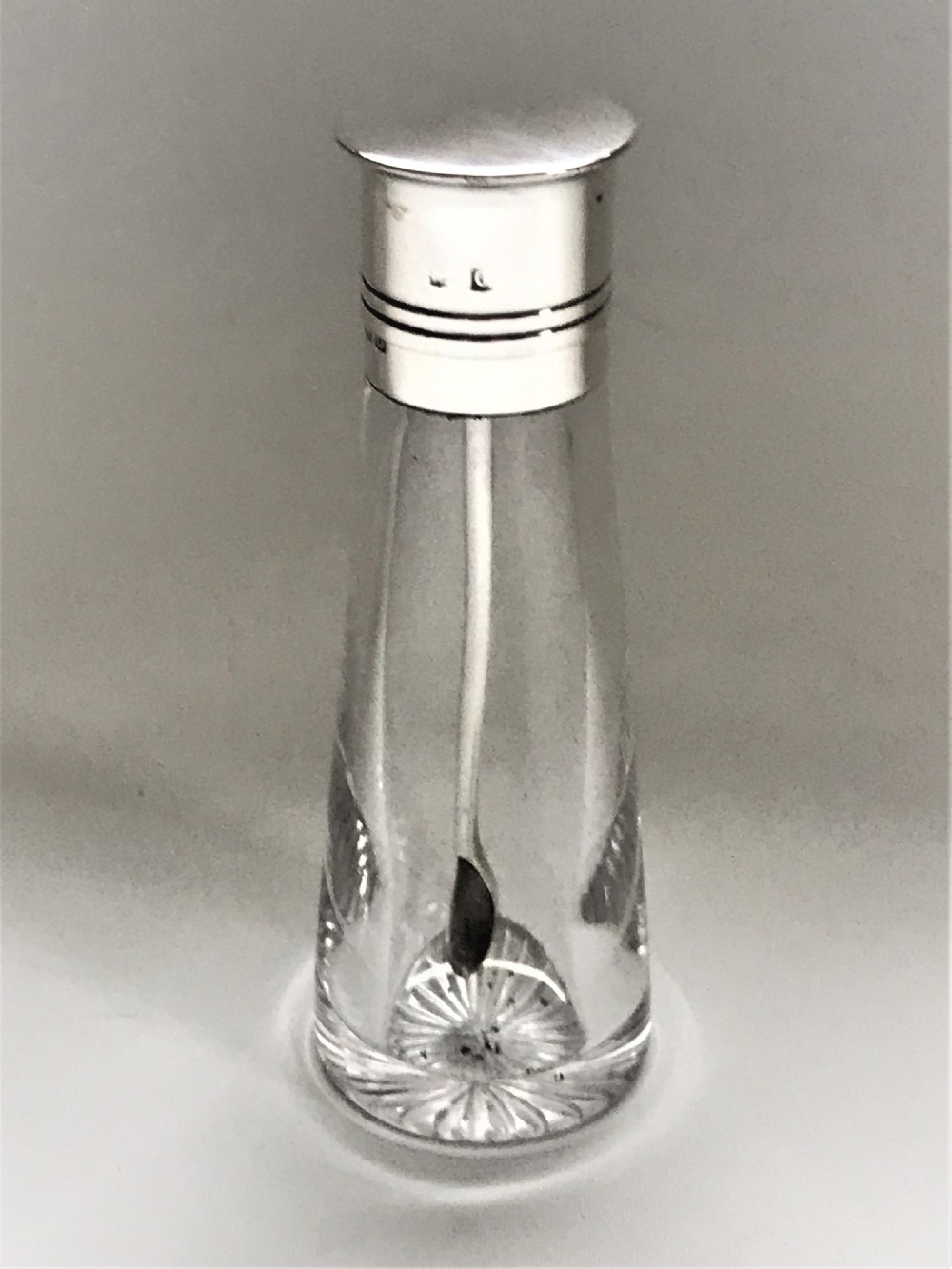 A wonderful silver mounted cayenne bottle & spoon