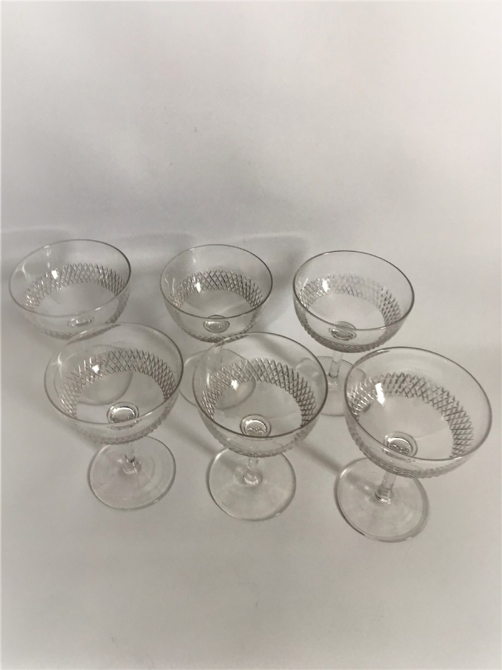 A set of 6 Edwardian cut glass champagne bowls View III