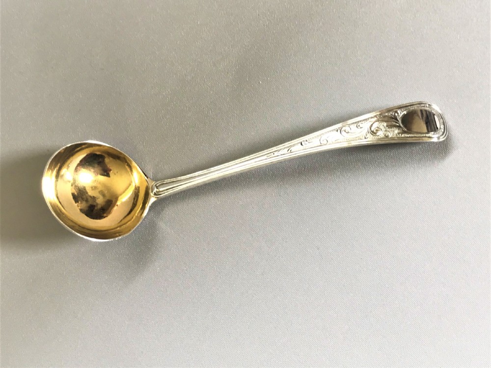A delightful 18th Century silver cream ladle